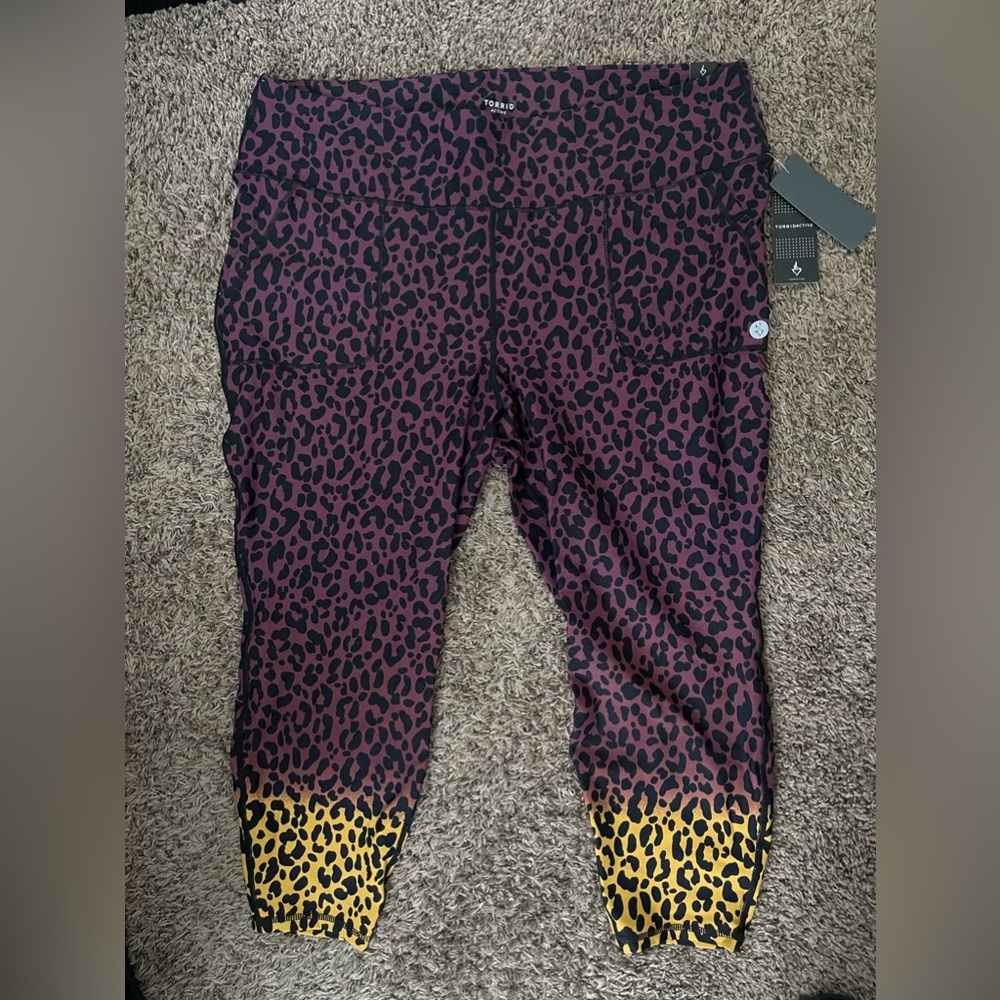 NWT Torrid Active Leggings. Leopard print purple and yellow